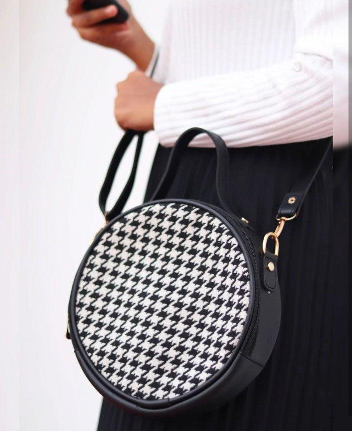 Monochrome round sling bag